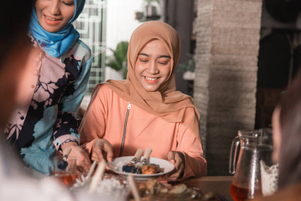 istock friends gathering enjoy the iftar meal 1150227077