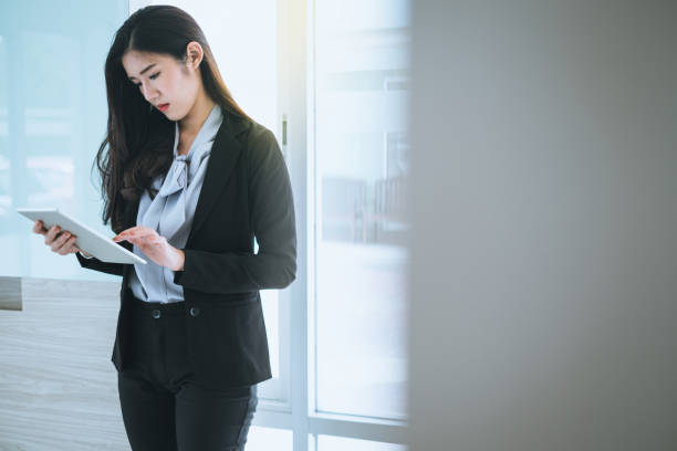 istock Businesswoman using the tablet to analyze business data 1150227186