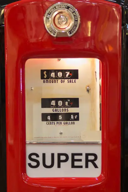 Parma, Italy - March 2018: Texaco Vintage Red and Brilliant Gasoline Pump on sale in the Street.