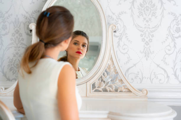 istock Beautiful Young Woman At Her Dressing Table 1150230066