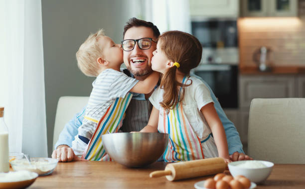 father with children   baking cookies father with children preparing food, baking cookies father stock pictures, royalty-free photos & images