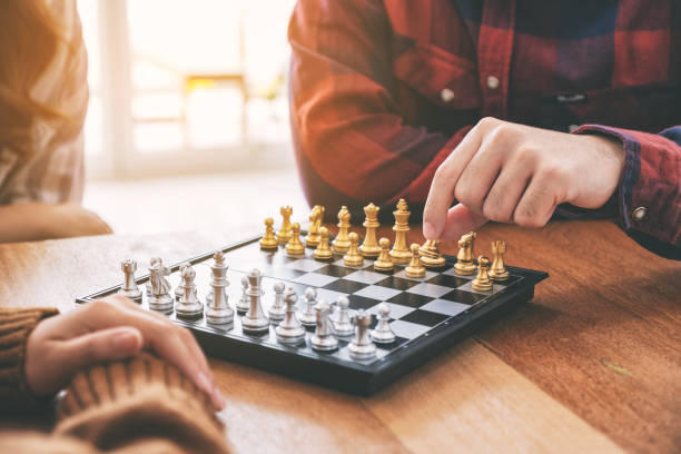istock people moving and playing chessboard game 1150234160
