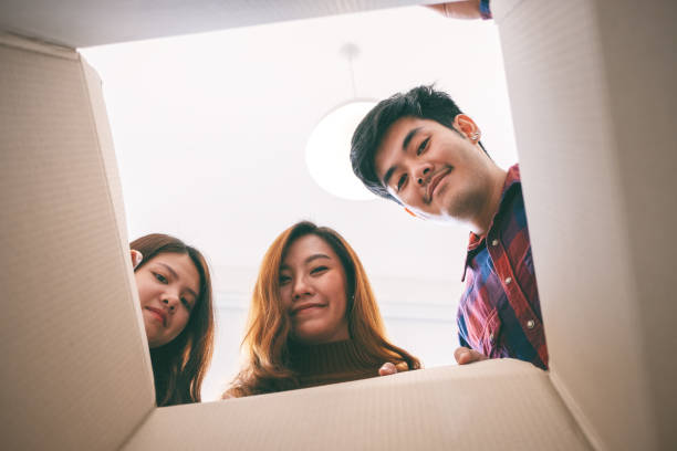 istock people opening and looking for a gift in the box 1150234161