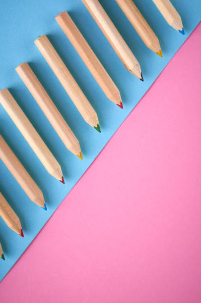 istock Wooden color pencils on blue background, flat lay 1150234949