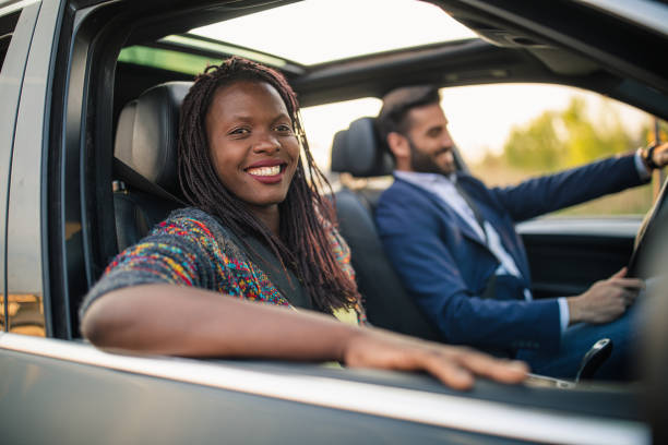 istock Happy friends driving in the car 1150236442