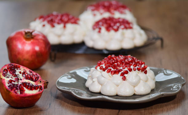 istock Pavlova cake with pomegranate. Meringue cake with pomegranate. 1150237552