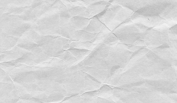 Gray wrinkled paper textured background stock photo