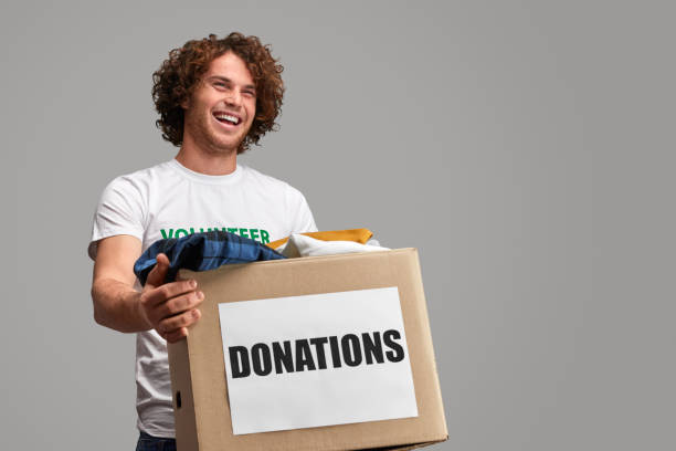 istock Excited volunteer carrying clothes 1150239882