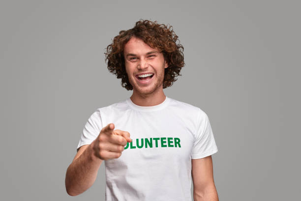 istock Cheerful man recruiting volunteers 1150239903