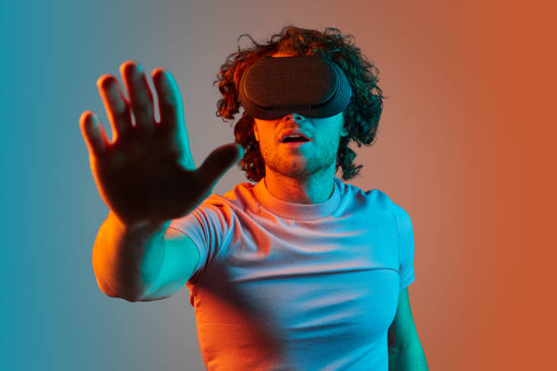 istock Shocked male interacting with virtual reality 1150239966