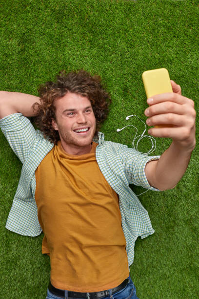 istock Male taking selfie on lawn 1150239999