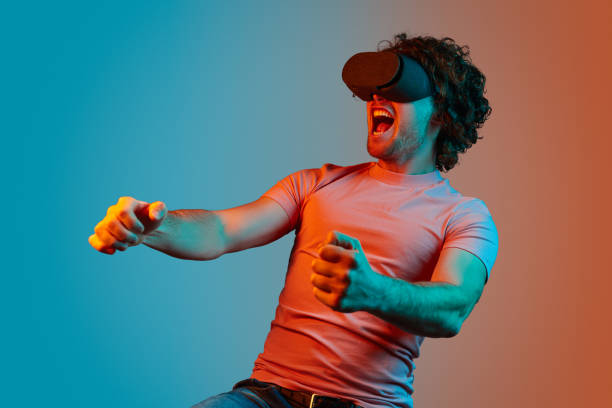 istock Man in VR glasses playing racing game 1150240050