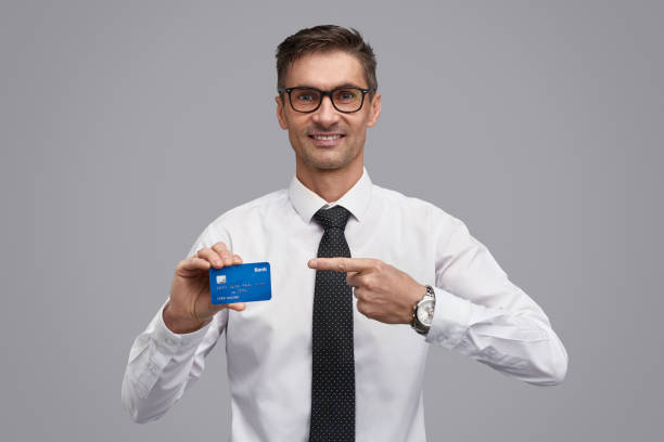 istock Businessman pointing at credit card 1150240131