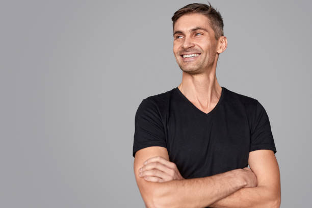 Confident male smiling and looking away