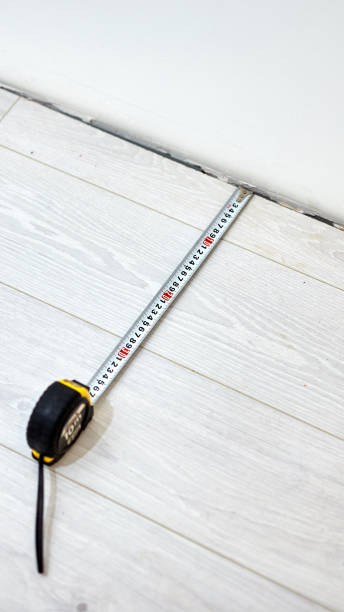 istock Tape measure for home renovation and laminate flooring. 1150245453