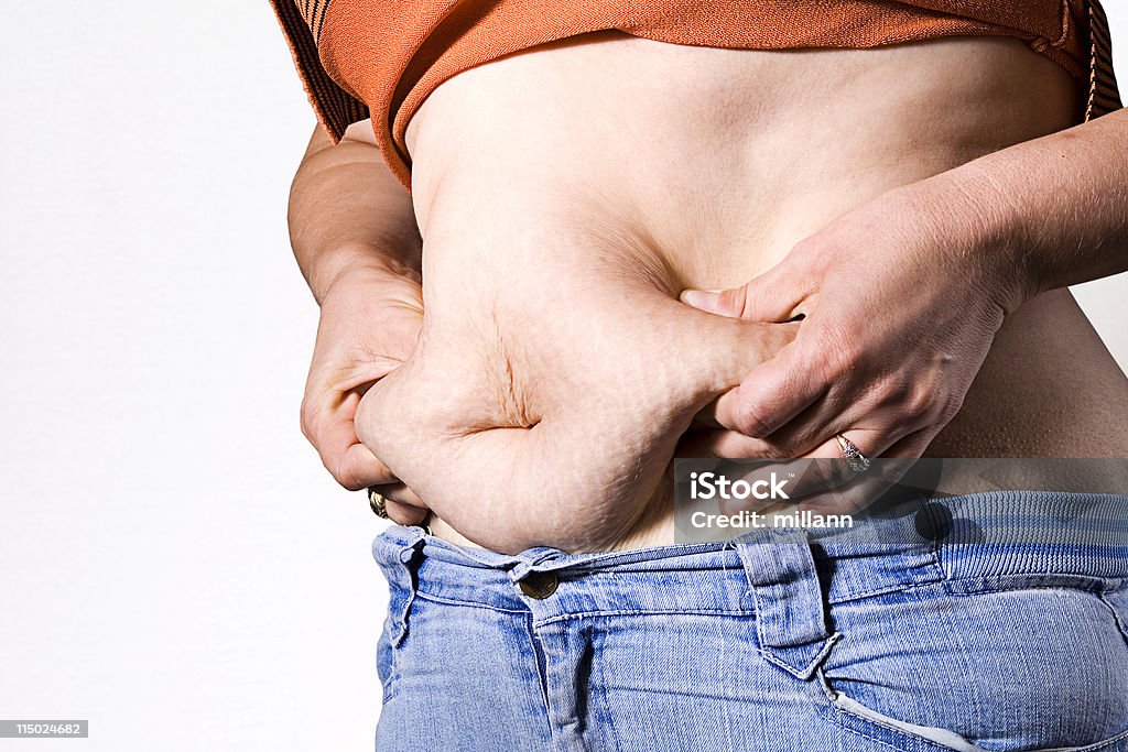 cellulite sur le ventre - Photo de Alimentation lourde libre de droits