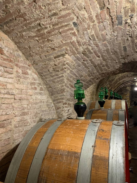 istock Oak barrels in an old underground wine cellar. 1150248466