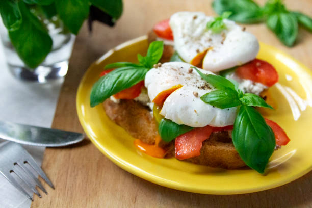istock Healthy breakfast sandwiches with basil, tomato and poached egg 1150251617