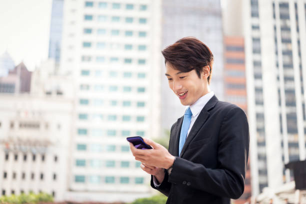 istock Chinese businessman using his smartphone 1150252220