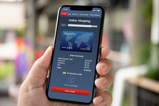 istock man hand holding phone with app online shopping on screen 1150252553