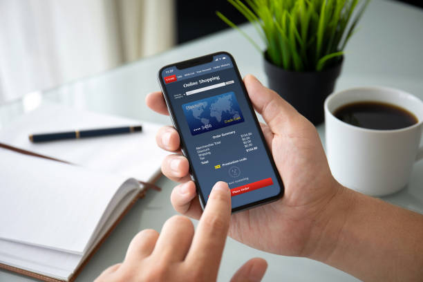 istock man hands holding phone with app online shopping on screen 1150252563