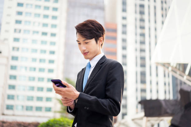 istock Chinese businessman using his smartphone 1150252565