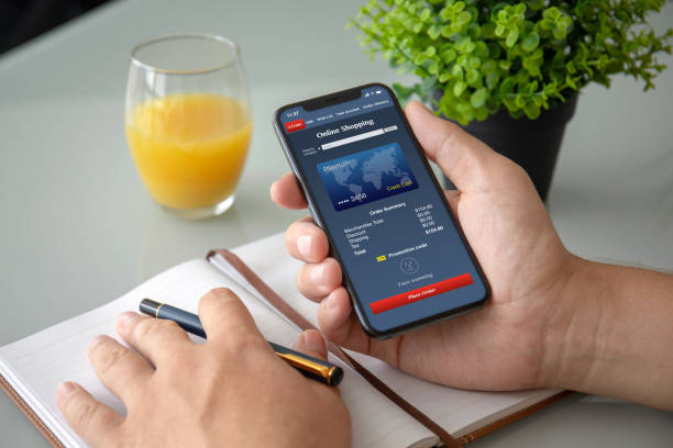 istock man hands holding phone with app online shopping on screen 1150252580