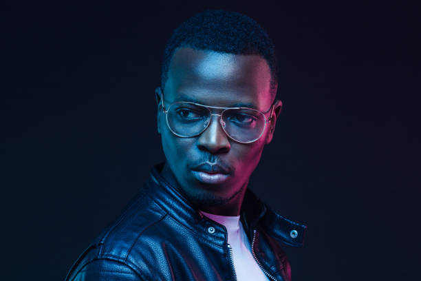 istock African guy in tranparent glasses and black leather jacket looking sidewards 1150254209
