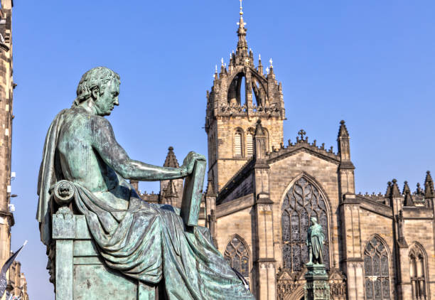 istock David Hume Statue and St Giles Cathedral in Edinburgh , Scotland 1150254865