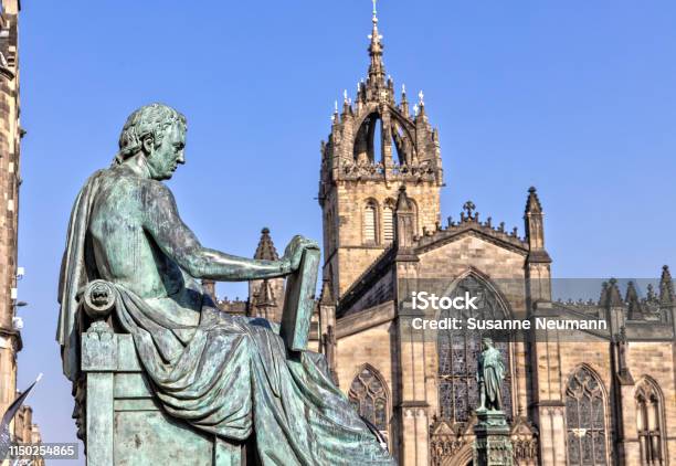David Hume Statue And St Giles Cathedral In Edinburgh Scotland Stock Photo - Download Image Now