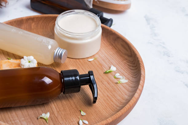 istock Natural cosmetics in small bottles on the white marble table 1150256251