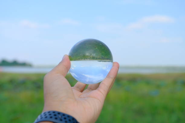 istock Looking at the world and nature through crystal ball 1150256472