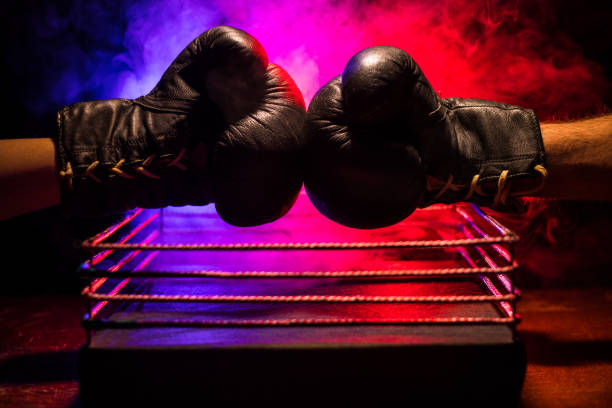 istock Empty boxing ring with red ropes for match in the stadium arena. Creative artwork decoration 1150262339