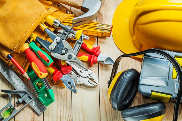 istock helmet construction tools in tool belt and toolbox with earphones on wood boards 1150263443