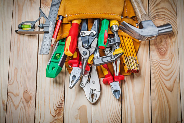 istock set of construction tools in toolbelt on wood boards close up 1150263449