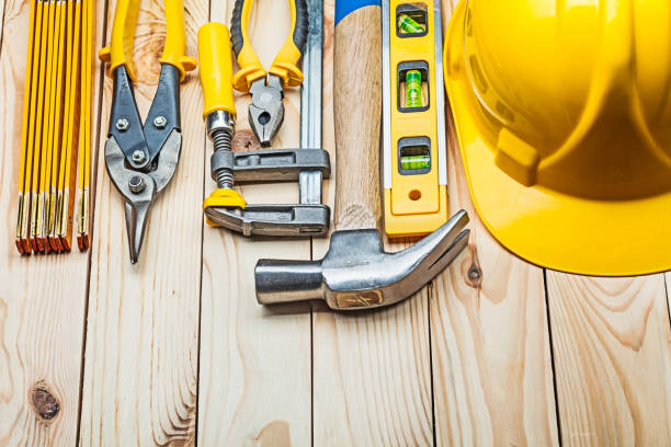 istock yellow helmet and construction tools on wooden boards 1150263463