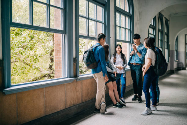 istock Asian students resting in the hall and discussing next class. 1150264766