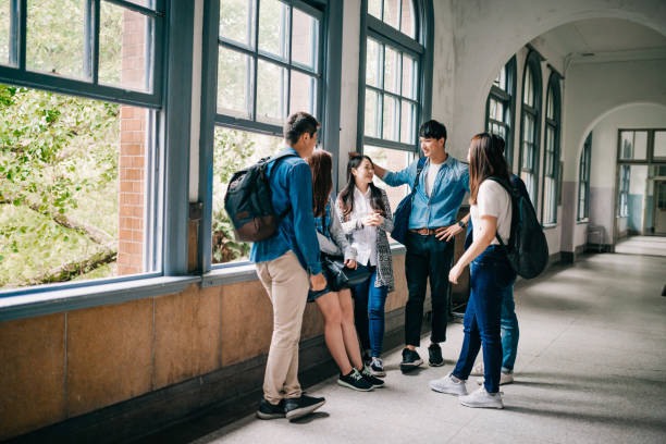 istock Asian students resting in the hall and discussing next class. 1150264965