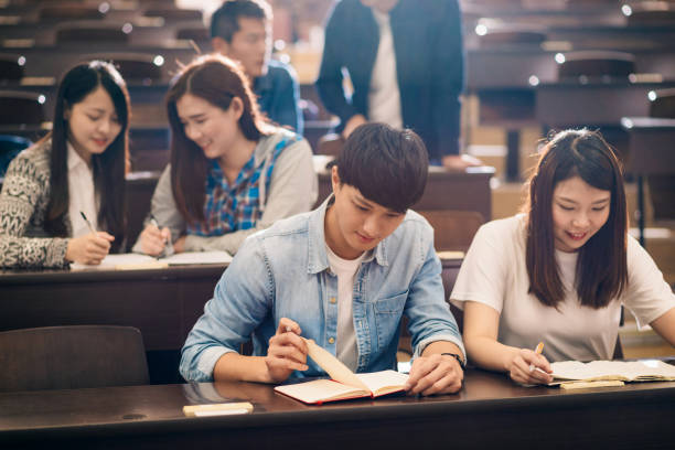 istock Relaxation in lecture hall after seminar - Asian students learning together. 1150265996