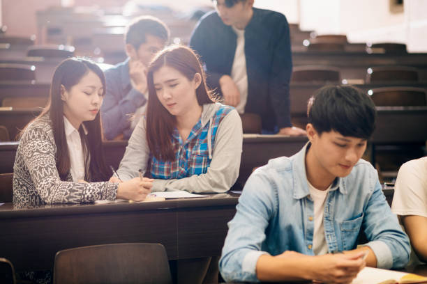 istock Relaxation in lecture hall after seminar - Asian students learning together. 1150266833