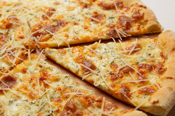 istock Italian pizza with several varieties of cheese, close-up 1150269143
