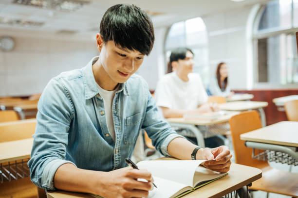 istock Post graduate students in East Asia dealing with real business tasks. 1150270114