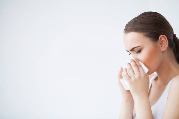 istock Flu and Sick Woman. Sick Woman Using Paper Tissue, Head Cold Problem 1150270673
