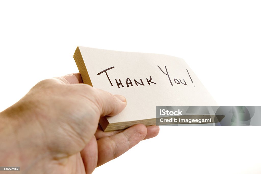 Thank You Giving a hand written Thank You note. Color Image Stock Photo