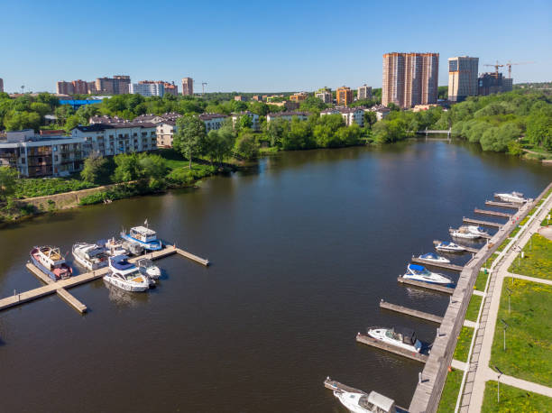 The Cityscape of Khimki city and yacht parking on the river. Russia Cityscape of Khimki city and yacht parking on the river. Russia khimki stock pictures, royalty-free photos & images