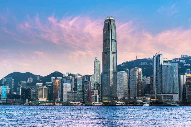 Hong Kong viewed from Victoria harbor at Twilight Hong Kong, Asia, China - East Asia, Victoria - Hong Kong, Victoria Harbour - Hong Kong hong kong business district stock pictures, royalty-free photos & images