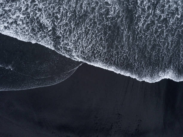 istock Aerial drone shoot from above black sand beach. Nature texture 1150277074