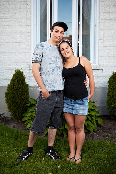 istock Young Couple in front of a house. 115027725