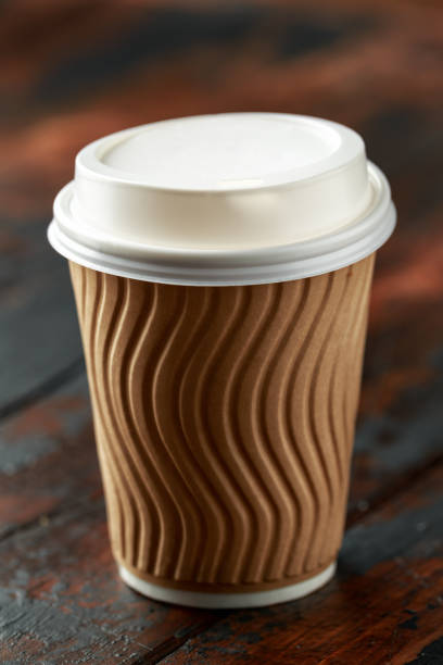 istock disposable paper takeaway coffee tea cup with lid. 1150279715