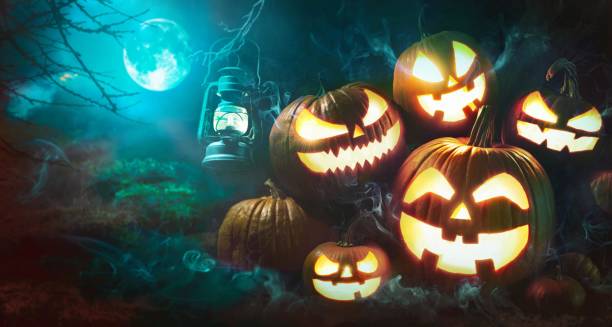 istock Halloween pumpkin head jack lantern with burning candles 1150282007